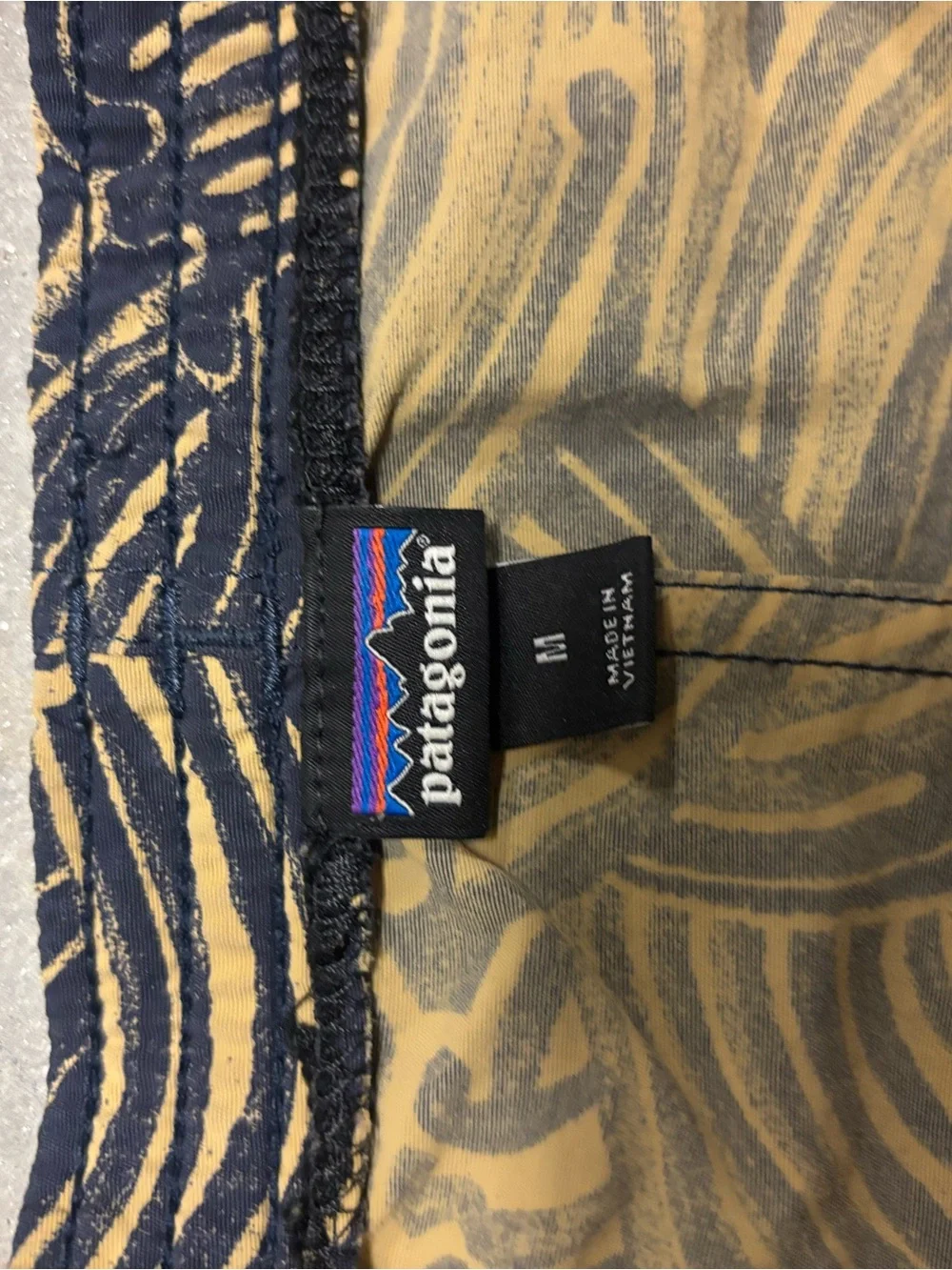 Patagonia x Common Threads Baggies Navy and Tan Wave-Print